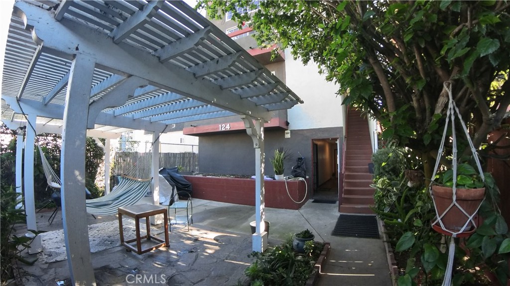 124 Buccaneer Street, Unit 1 Marina del Rey, CA 90292 - Photo 33 of 41 a backyard of a house with outdoor seating