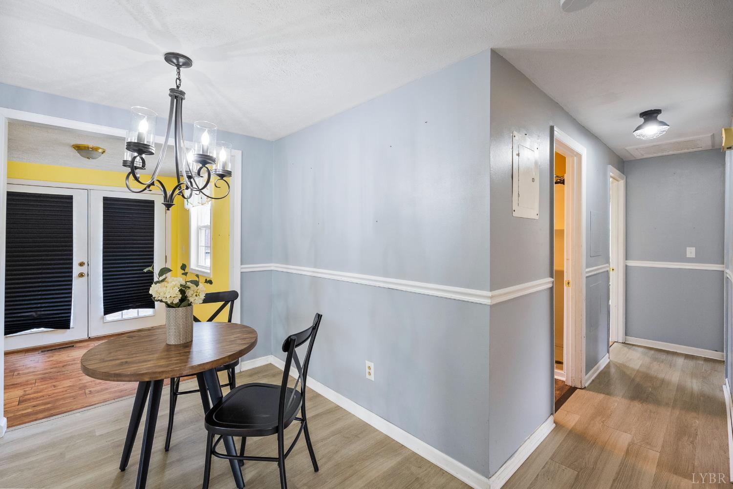 997 Toytown Road Amherst, VA 24521 - Photo 13 of 50 a view of a dining room with furniture window and wooden floor