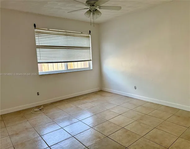 a view of an empty room and window
