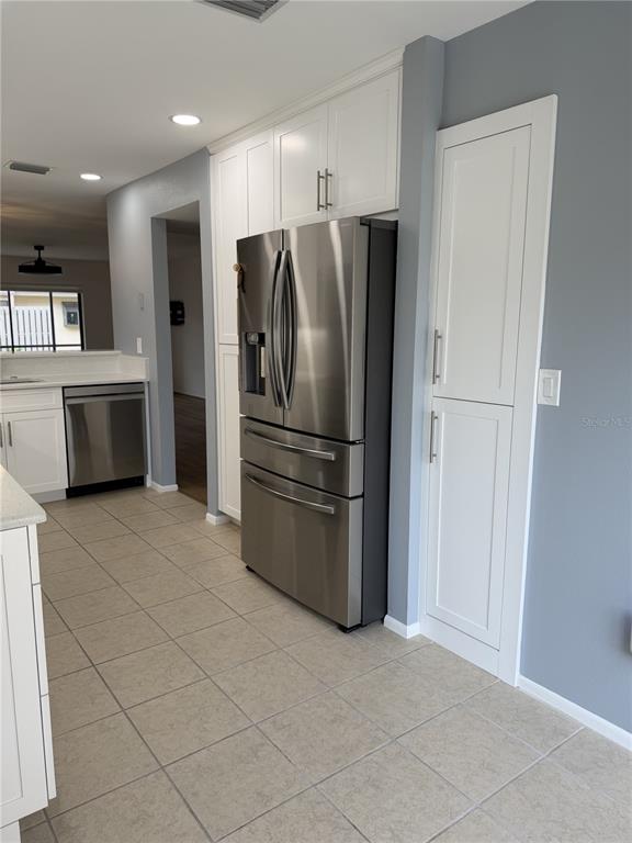 2004 Longpointe Circle Venice, FL 34293 - Photo 19 of 54 a kitchen with stainless steel appliances a refrigerator and a stove top oven