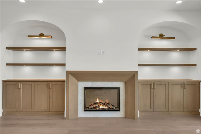 1620 Belayer Drive St. George, UT 84770 - Photo 8 of 51 Built-in fireplace with a light-toned mantel and stone surround