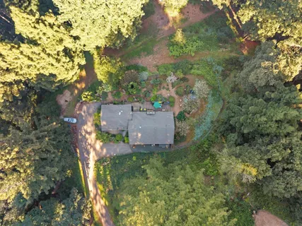 an aerial view of residential house with outdoor space