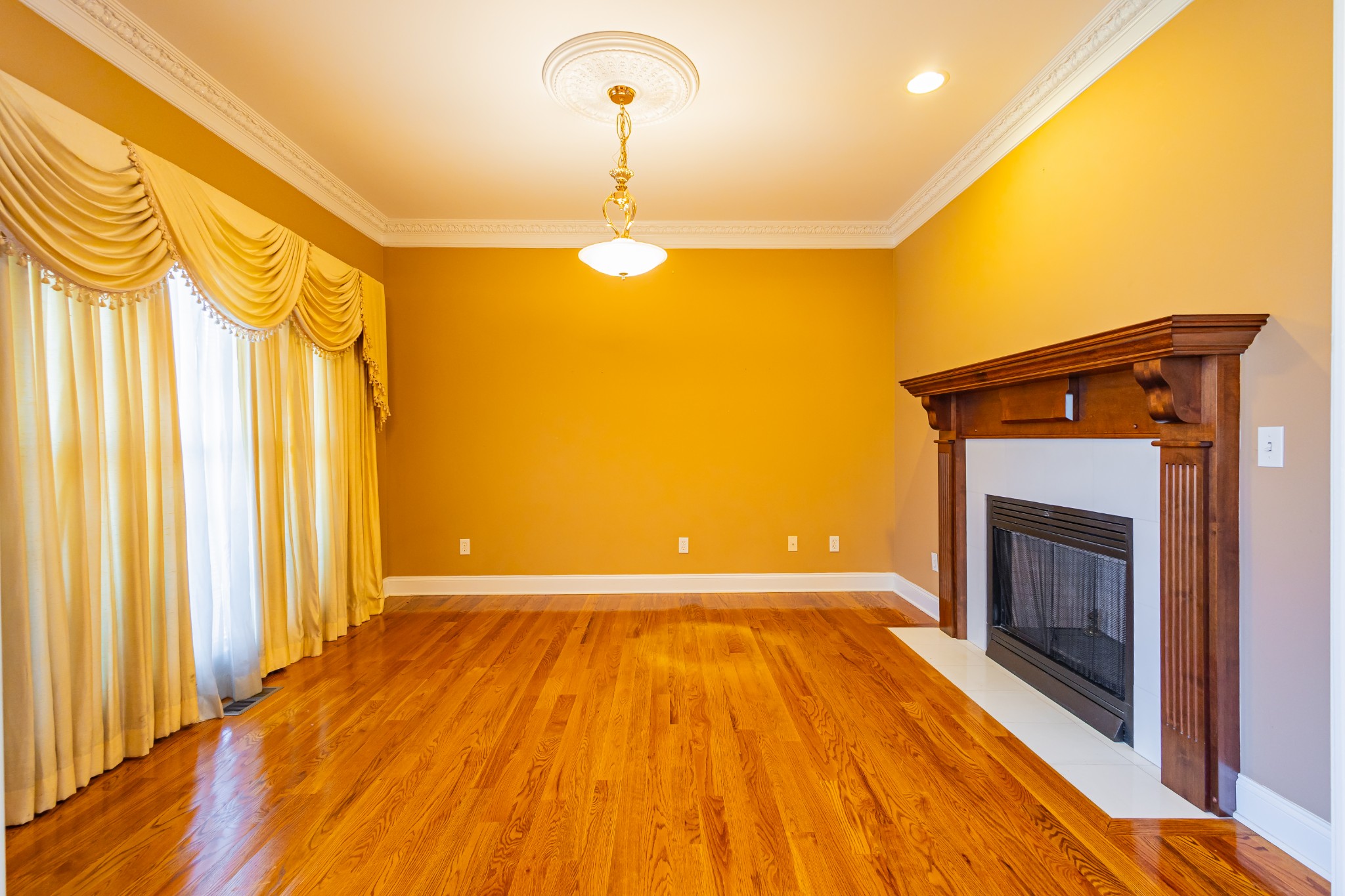 114 Courtside Lane Tullahoma, TN 37388 - Photo 12 of 85 a view of empty room with a fireplace and wooden floor