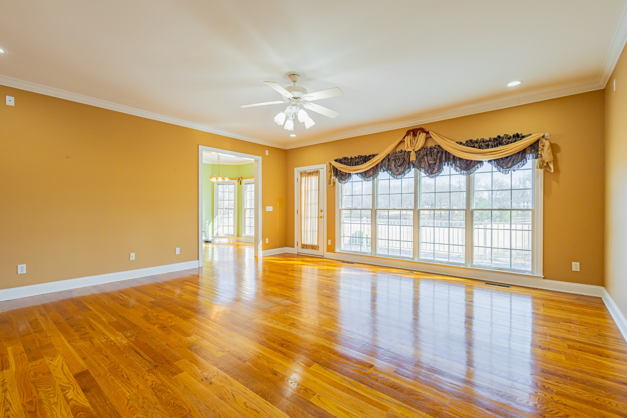114 Courtside Lane Tullahoma, TN 37388 - Photo 14 of 85 a view of an empty room with a window and wooden floor