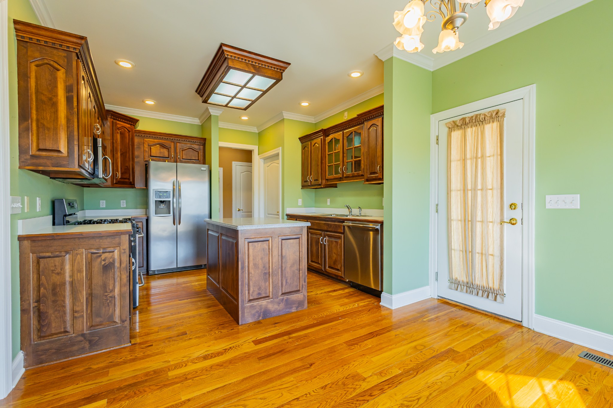114 Courtside Lane Tullahoma, TN 37388 - Photo 17 of 85 a view of kitchen with stainless steel appliances granite countertop a stove a sink dishwasher and a refrigerator with wooden floor