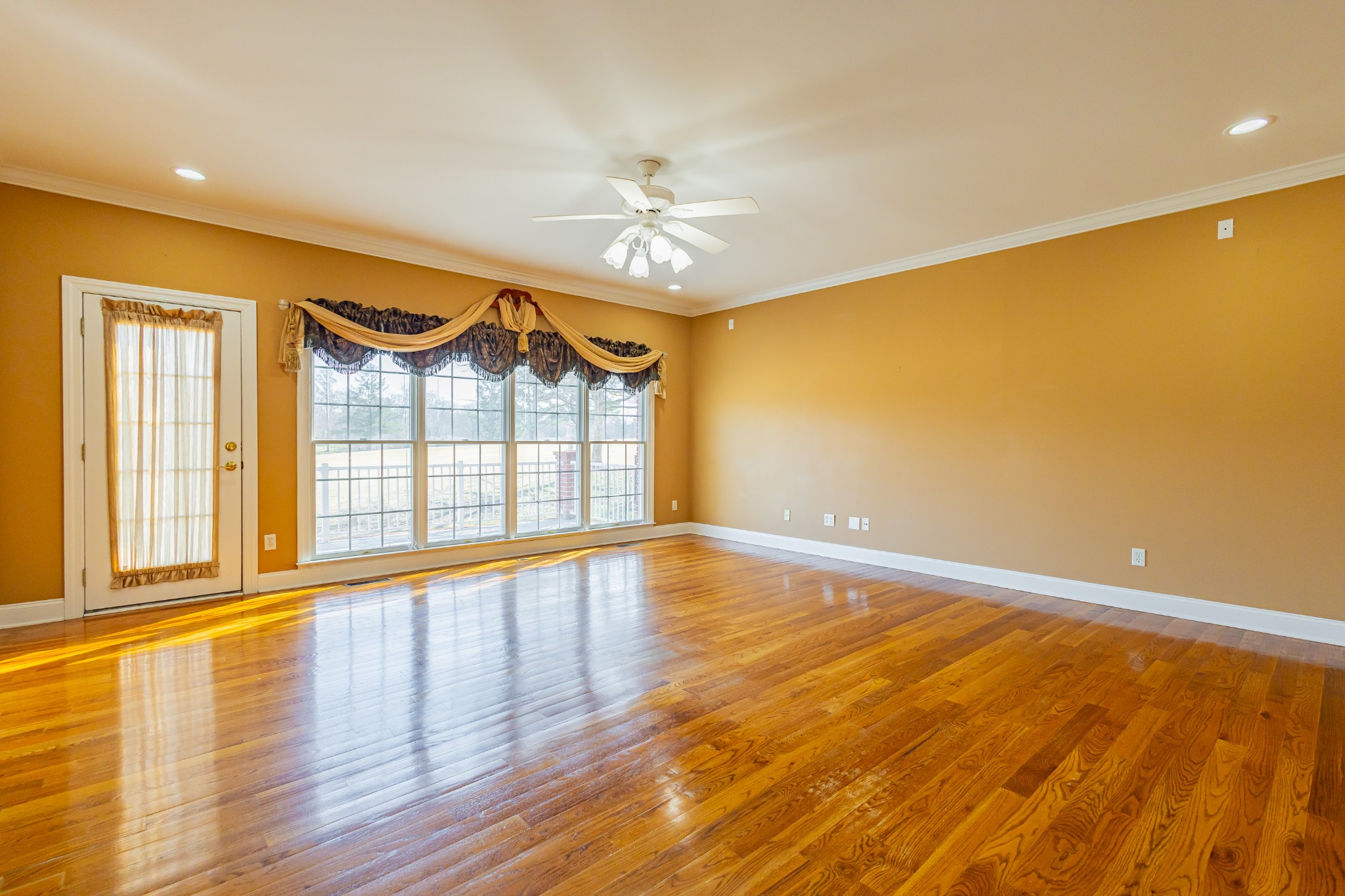 114 Courtside Lane Tullahoma, TN 37388 - Photo 2 of 85 a view of an empty room with a window and wooden floor
