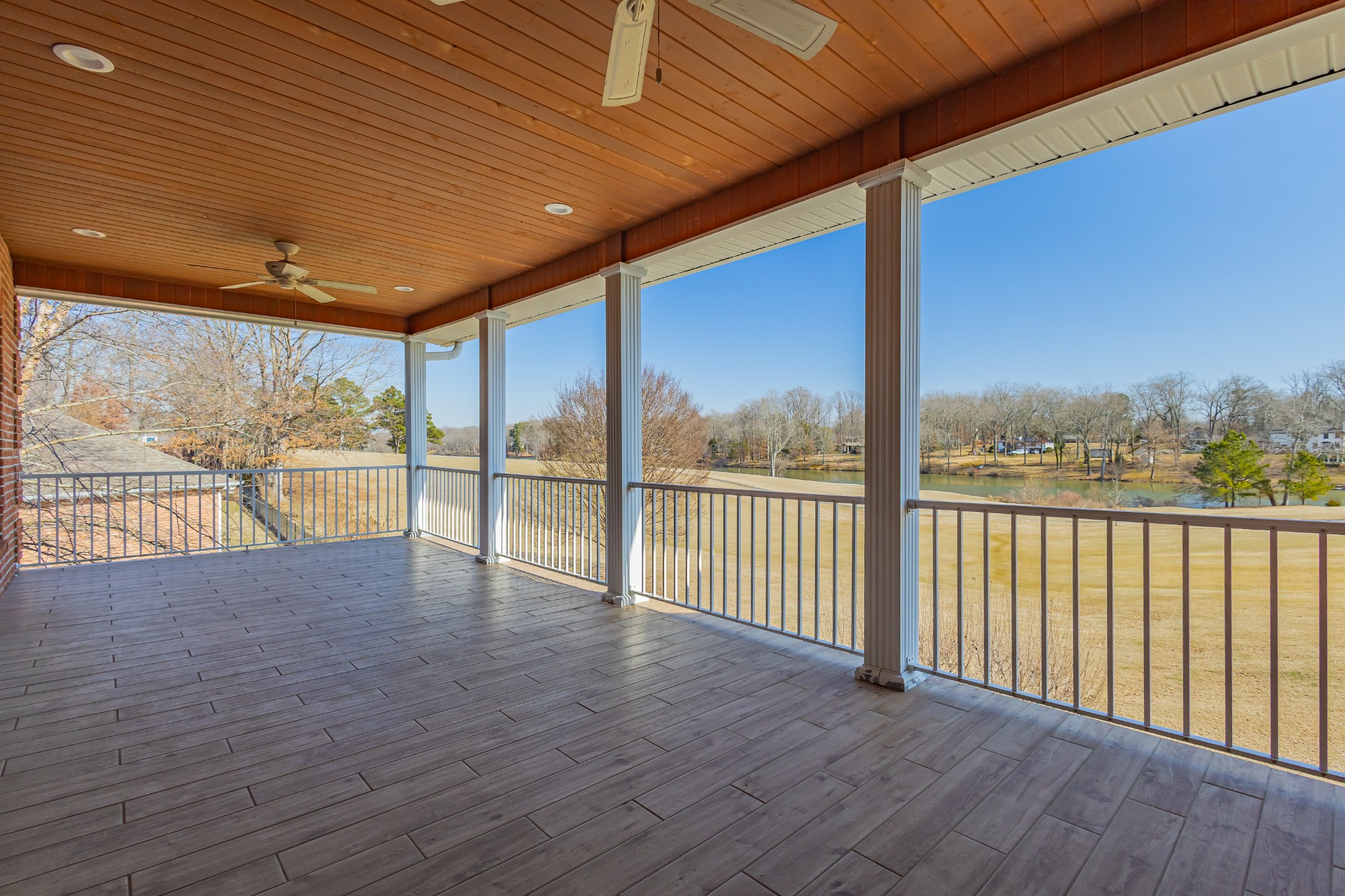 114 Courtside Lane Tullahoma, TN 37388 - Photo 76 of 85 a view of an empty room with wooden floor and iron stairs