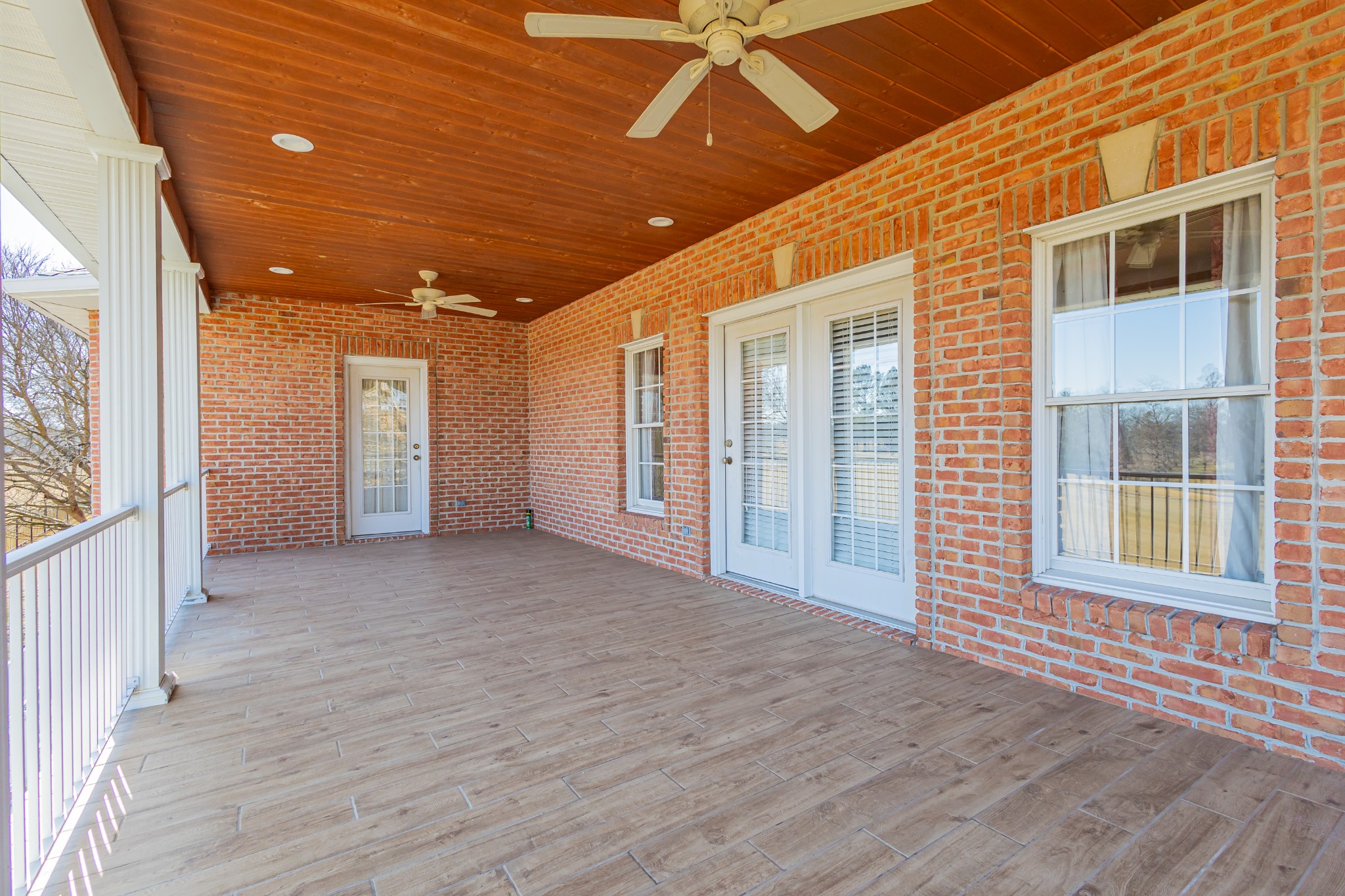 114 Courtside Lane Tullahoma, TN 37388 - Photo 77 of 85 a view of an empty room with wooden floor and a window