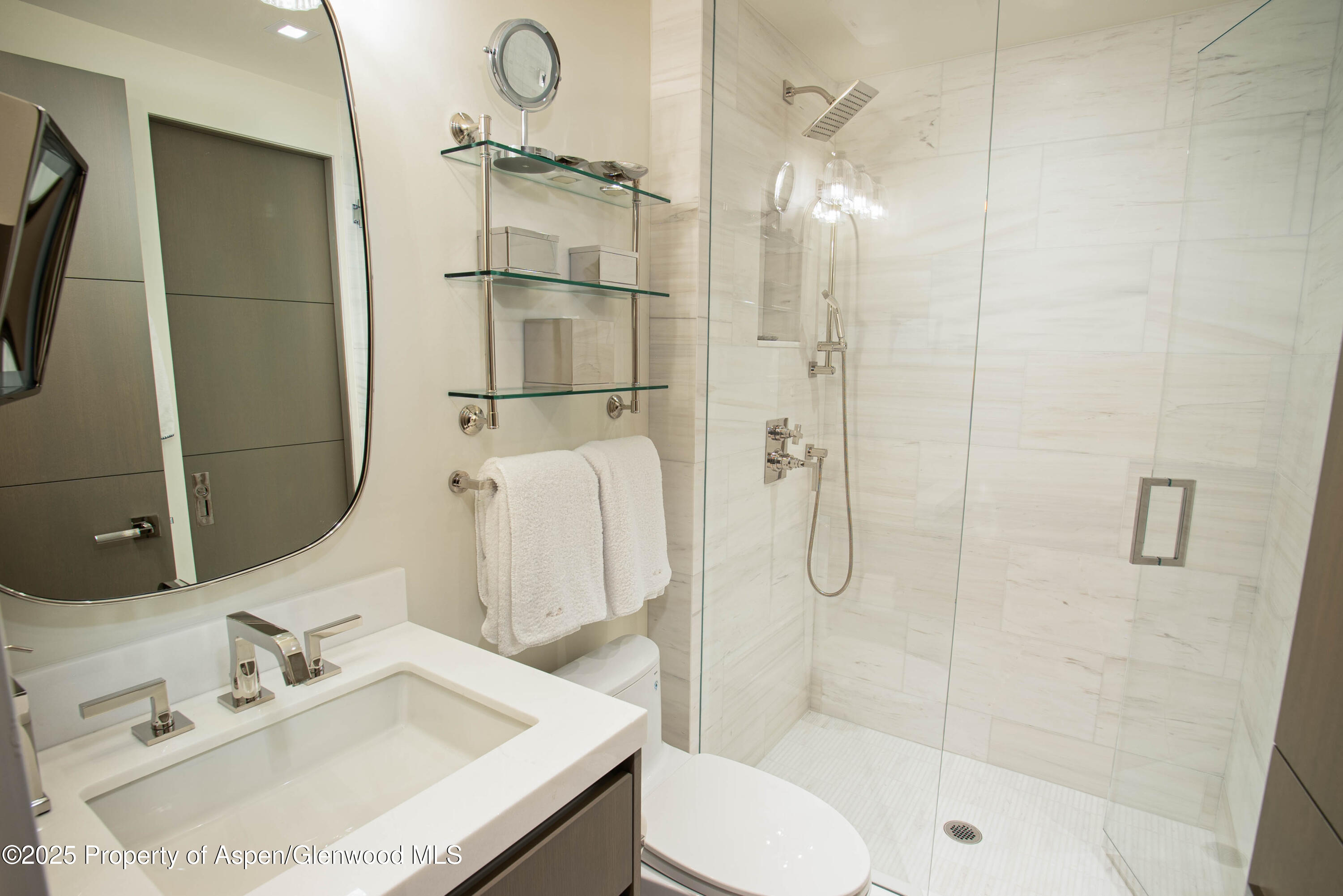 555 East Durant Avenue, Unit 3C Aspen, CO 81611 - Photo 15 of 16 a bathroom with a sink vanity granite toilet and shower