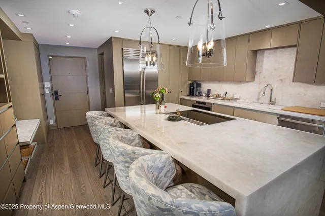 a kitchen with granite countertop a sink appliances and cabinets