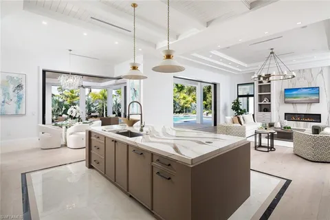 a kitchen with stainless steel appliances white cabinets and a sink