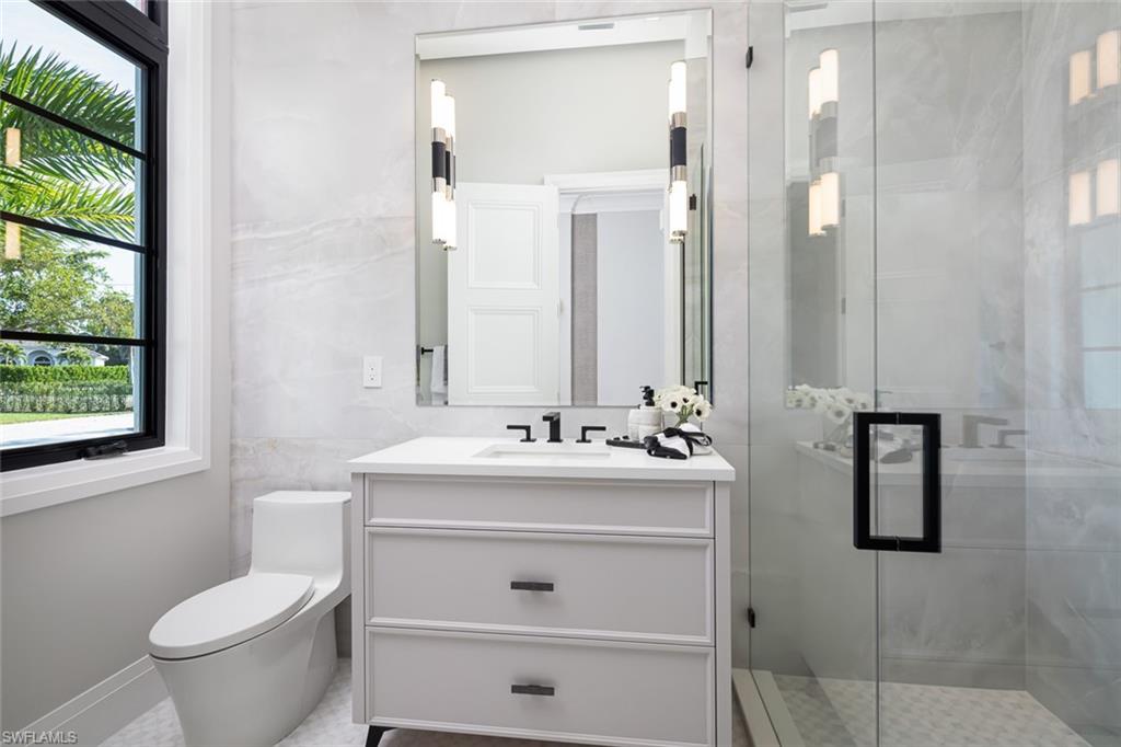 445 West Street Naples, FL 34108 - Photo 31 of 40 a bathroom with a sink toilet and shower