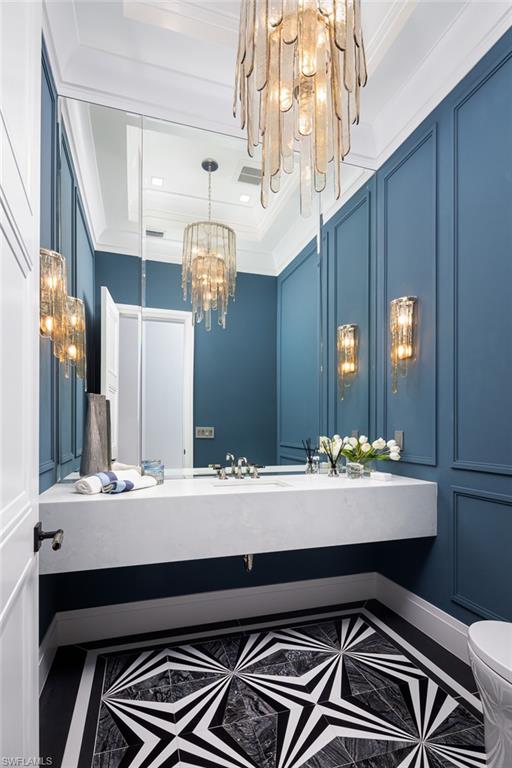 445 West Street Naples, FL 34108 - Photo 40 of 40 a bathroom with a sink and a mirror