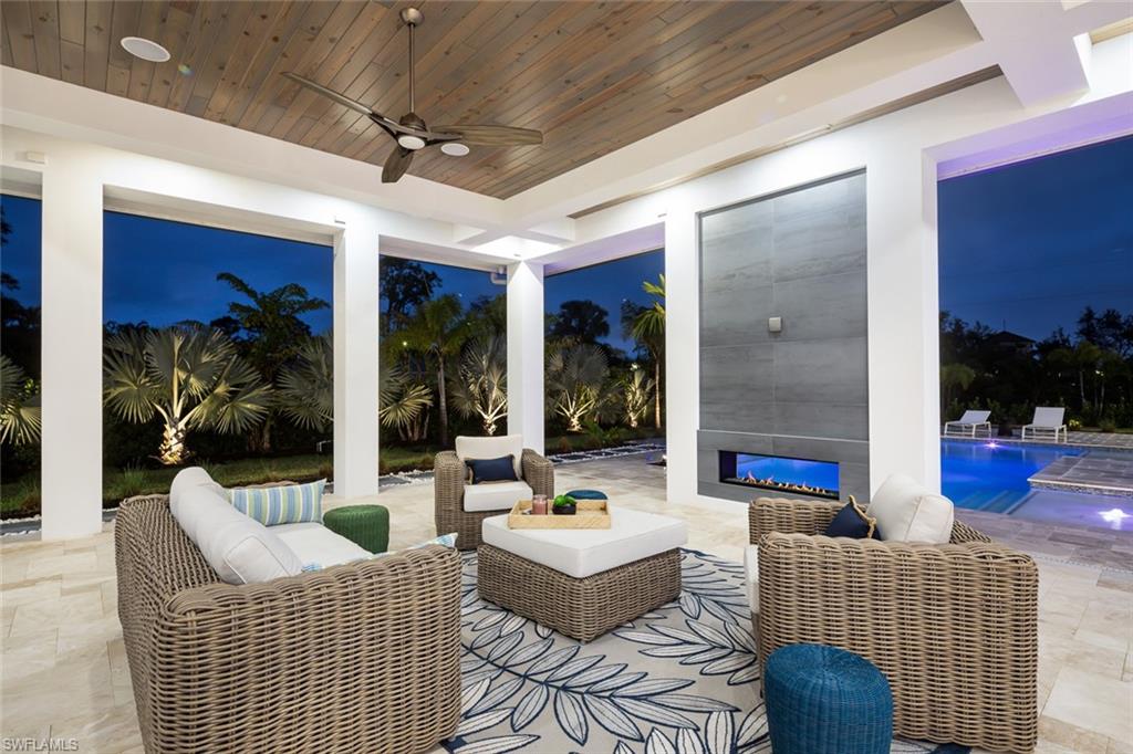445 West Street Naples, FL 34108 - Photo 5 of 40 a living room with furniture and a large window