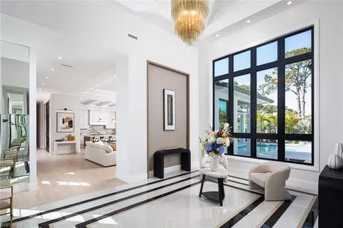 a living room with furniture ceiling fan and a rug