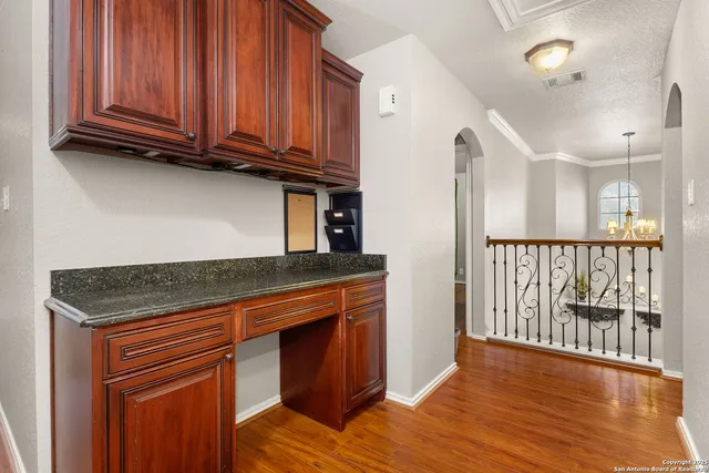 a view of a kitchen with wooden floor