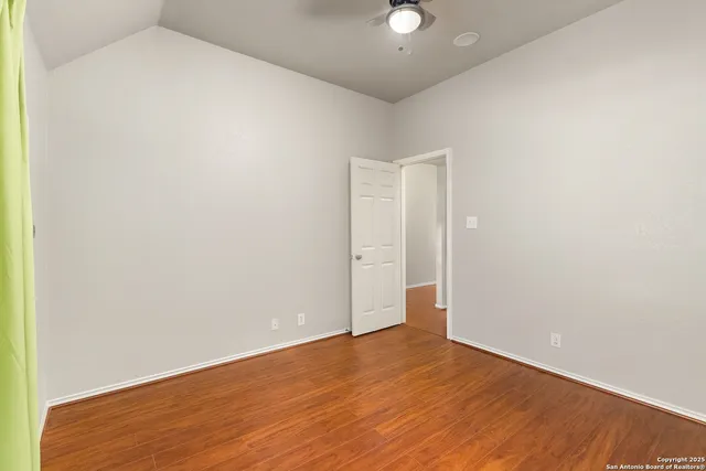 an empty room with wooden floor