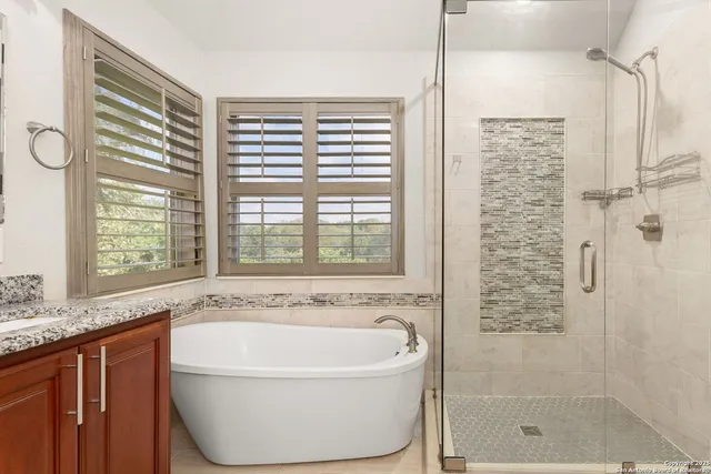 a bath tub sitting next to a window