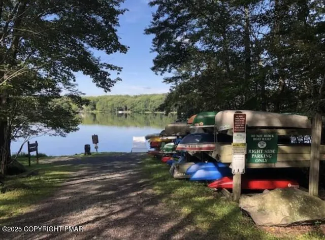 a kitchen with a stove a large window cabinets and stainless steel appliances