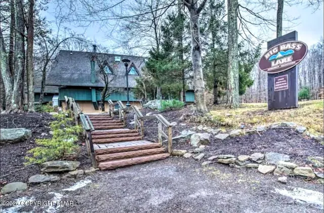 a table and chairs in front of a house