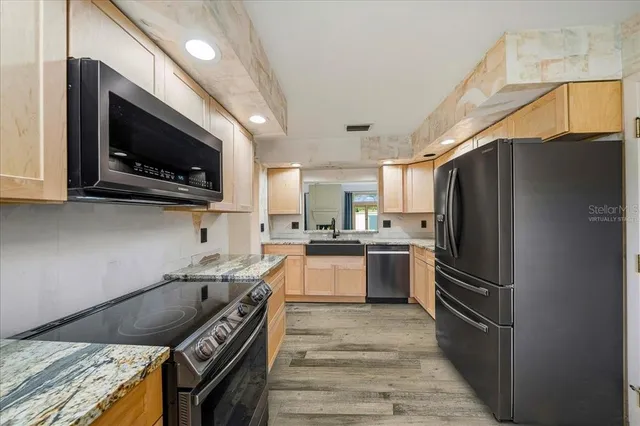 a kitchen with a stove and a microwave