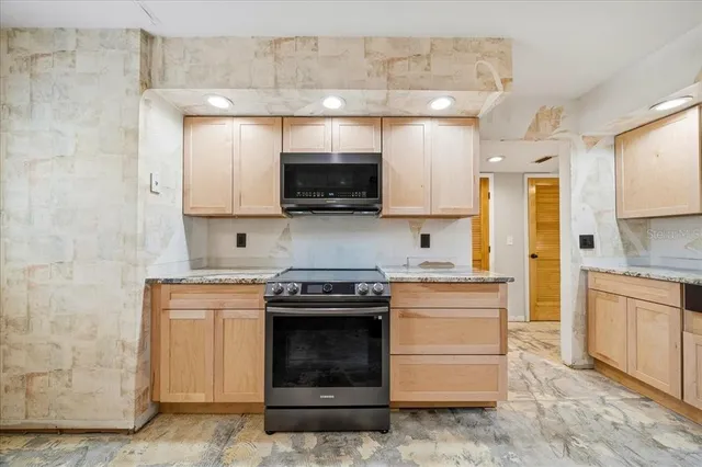 a view of a livingroom with an empty space and a window
