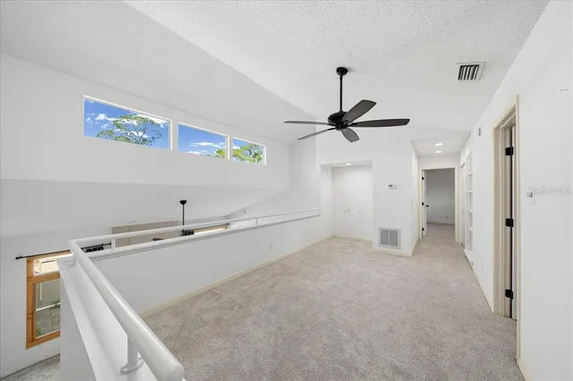 a spacious bathroom with a sink and a mirror
