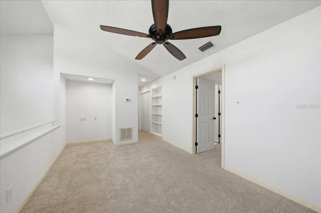 a view of a room with racks on the wall