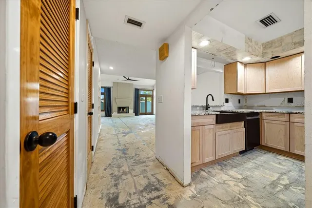 a kitchen with a refrigerator and a sink