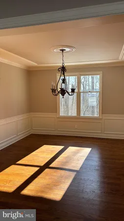 a view of a living room and wooden floor
