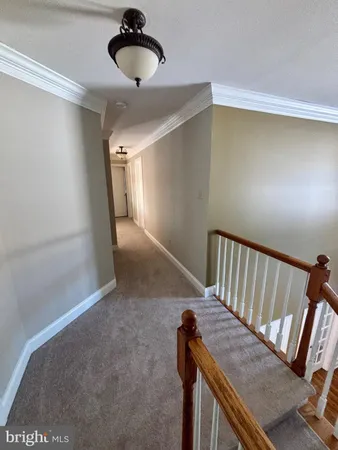 a view of a hallway with a chair