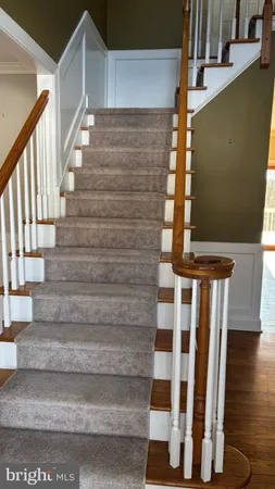 a view of entryway with wooden floor