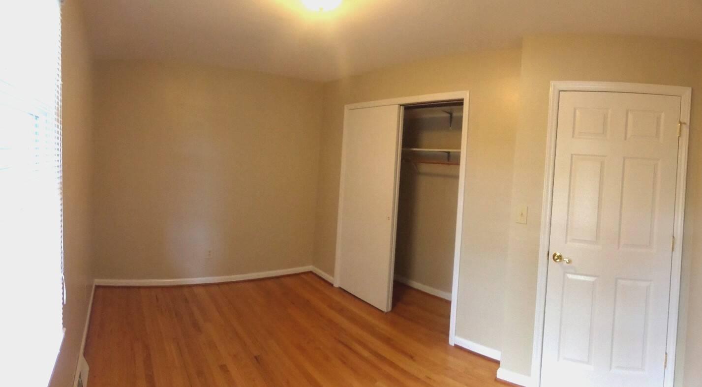 151 Timberline Drive Blue Ridge, VA 24064 - Photo 14 of 36 a view of an empty room with wooden floor and closet