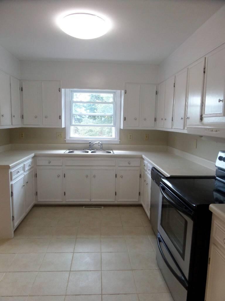 151 Timberline Drive Blue Ridge, VA 24064 - Photo 5 of 36 a kitchen with a sink stove and cabinets
