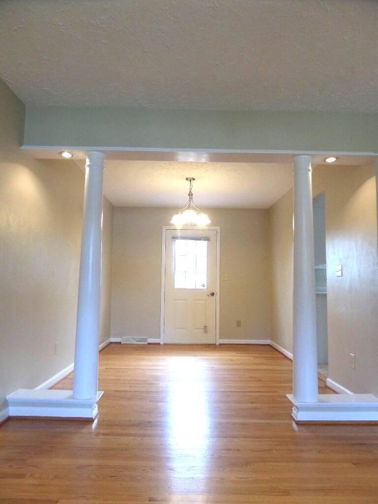 151 Timberline Drive Blue Ridge, VA 24064 - Photo 7 of 36 a view of empty room with wooden floor and fan
