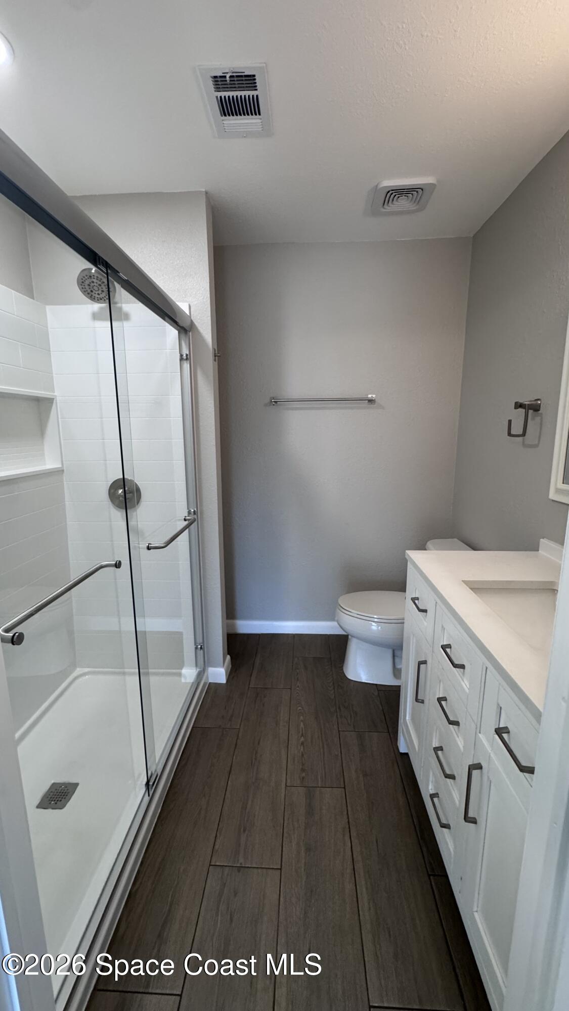 2137 Laden Road Melbourne, FL 32935 - Photo 12 of 23 a bathroom with a sink and a toilet
