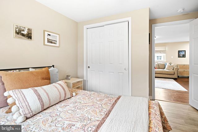 a bedroom with a large bed and a couch