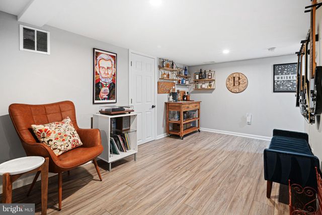 a view of a livingroom with furniture and workspace