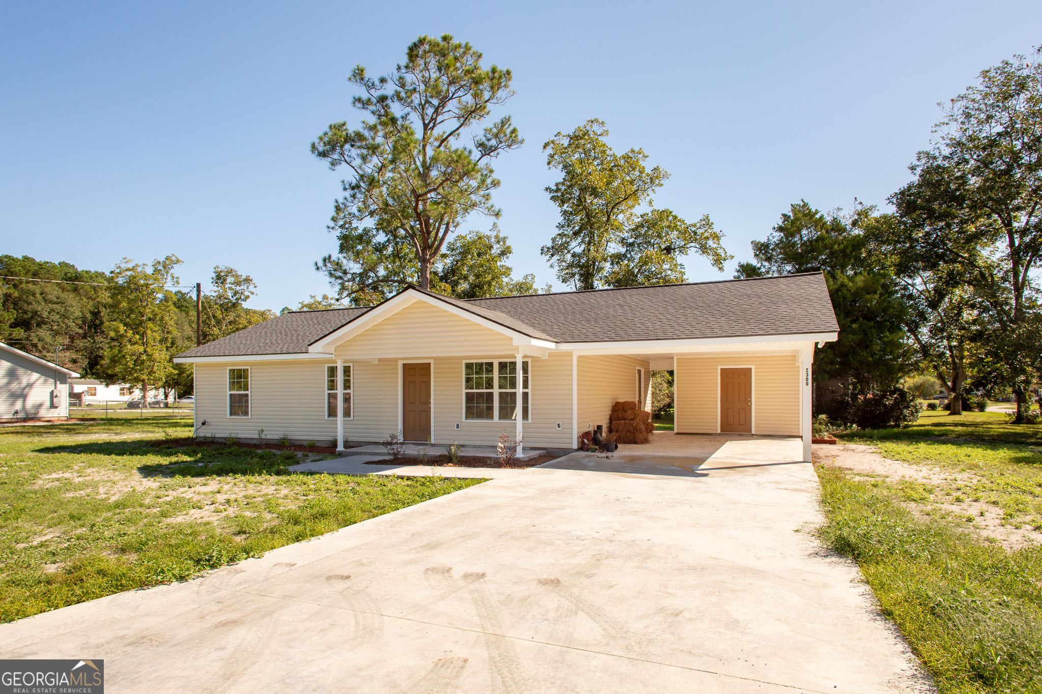 2350 Edgewood Street Waycross, GA 31501 - Photo 2 of 27 a front view of a house with a yard and trees