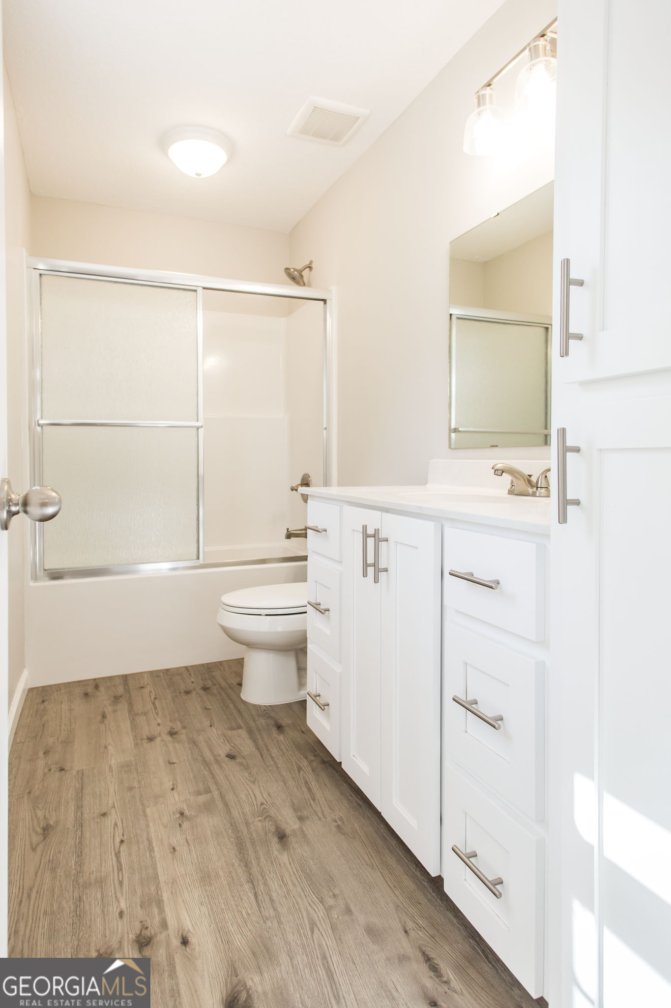 2350 Edgewood Street Waycross, GA 31501 - Photo 23 of 27 a bathroom with a sink a toilet and shower