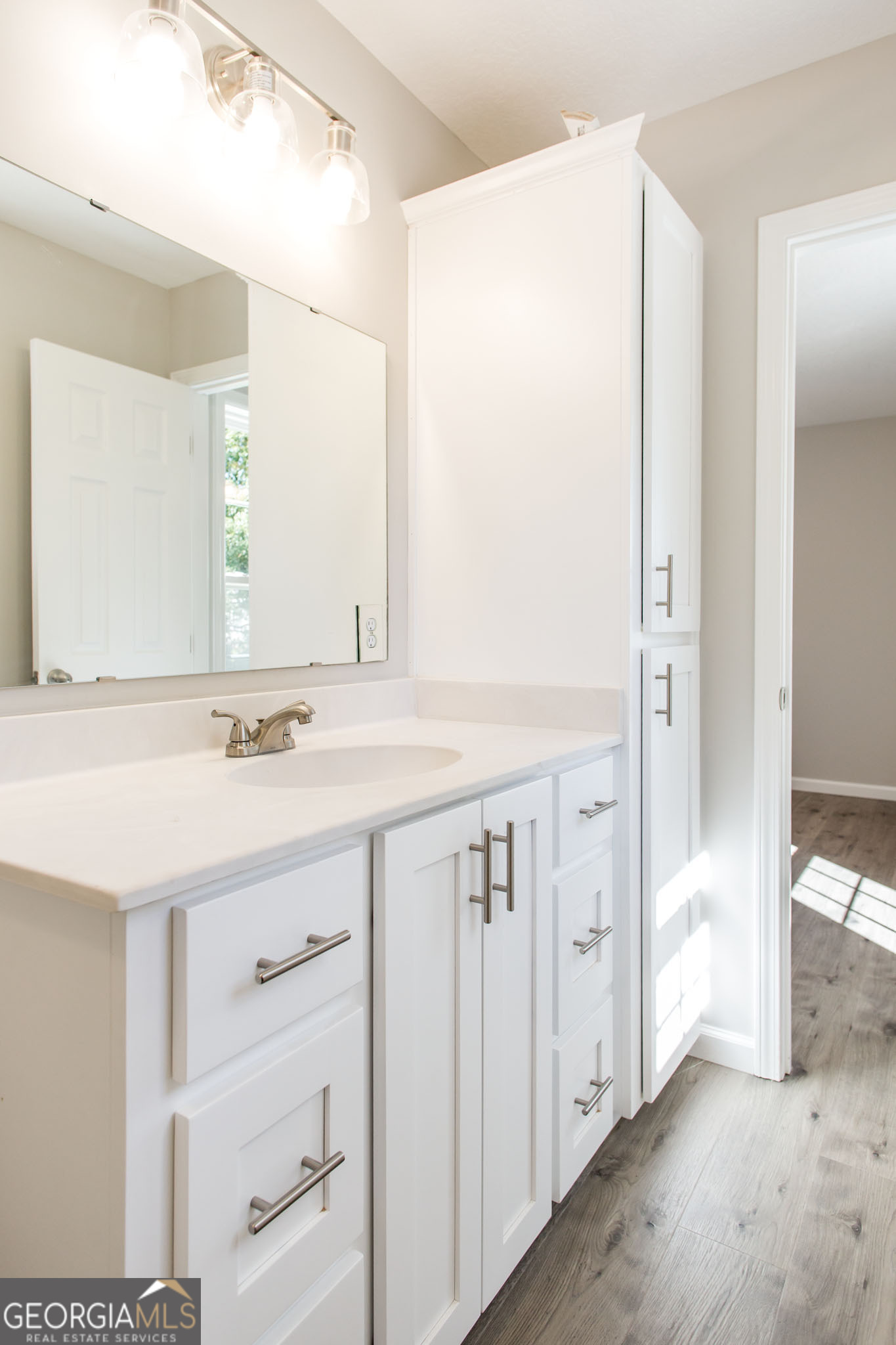 2350 Edgewood Street Waycross, GA 31501 - Photo 25 of 27 a bathroom with a double vanity sink and a mirror