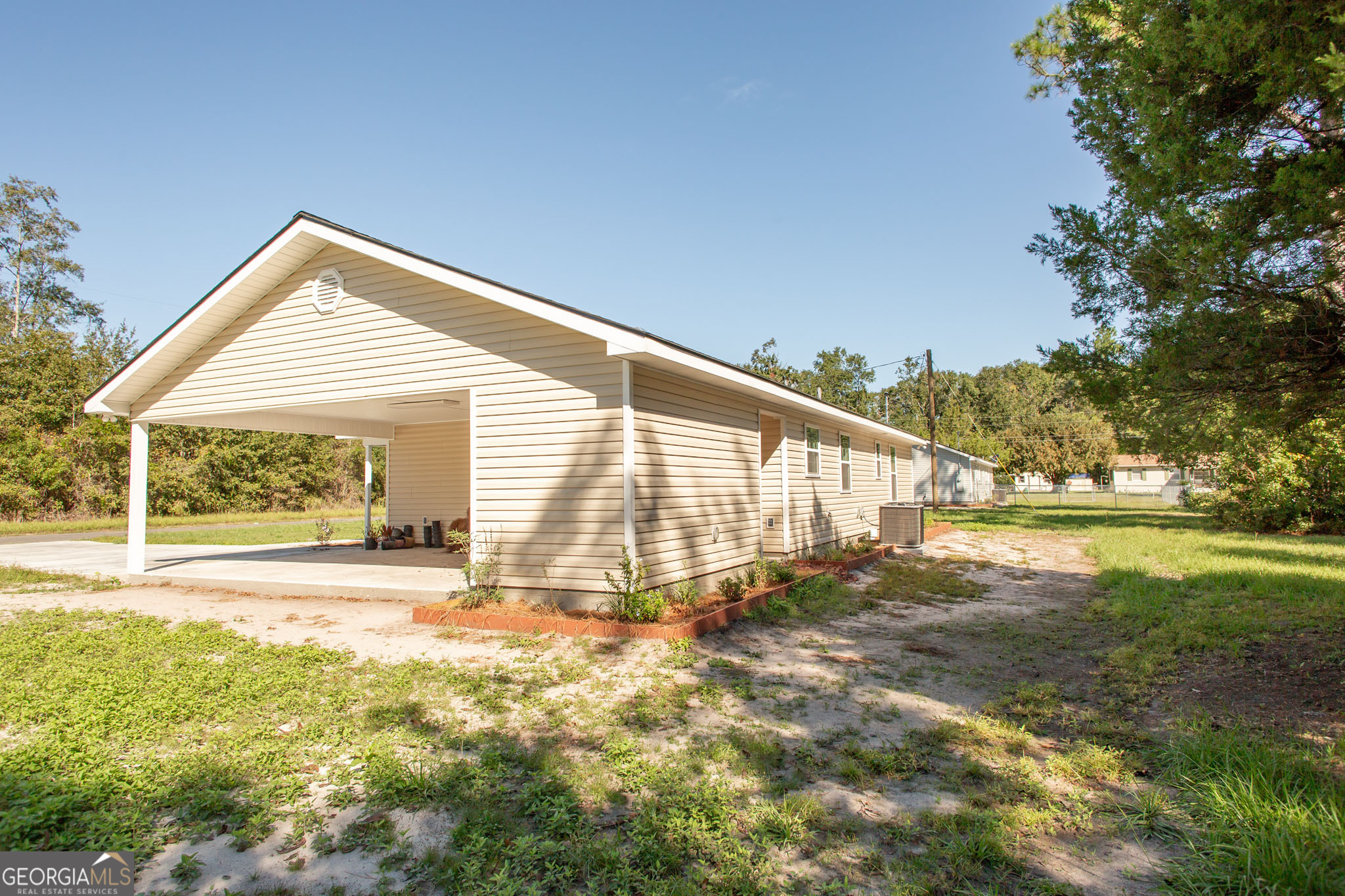 2350 Edgewood Street Waycross, GA 31501 - Photo 27 of 27 a view of a house with a yard and sitting area