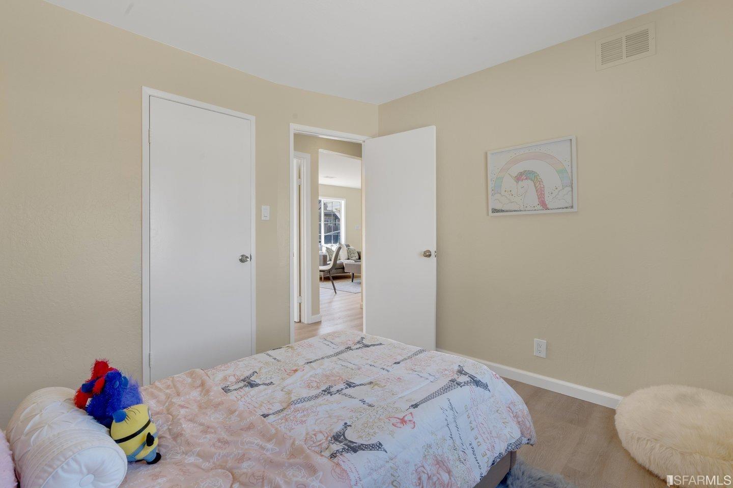 484 Lomond Drive Pacifica, CA 94044 - Photo 13 of 25 a bedroom with a bed and a window