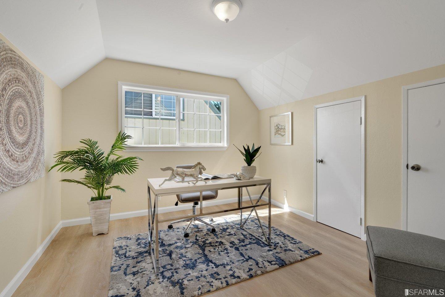 484 Lomond Drive Pacifica, CA 94044 - Photo 14 of 25 a living room with furniture and a potted plant