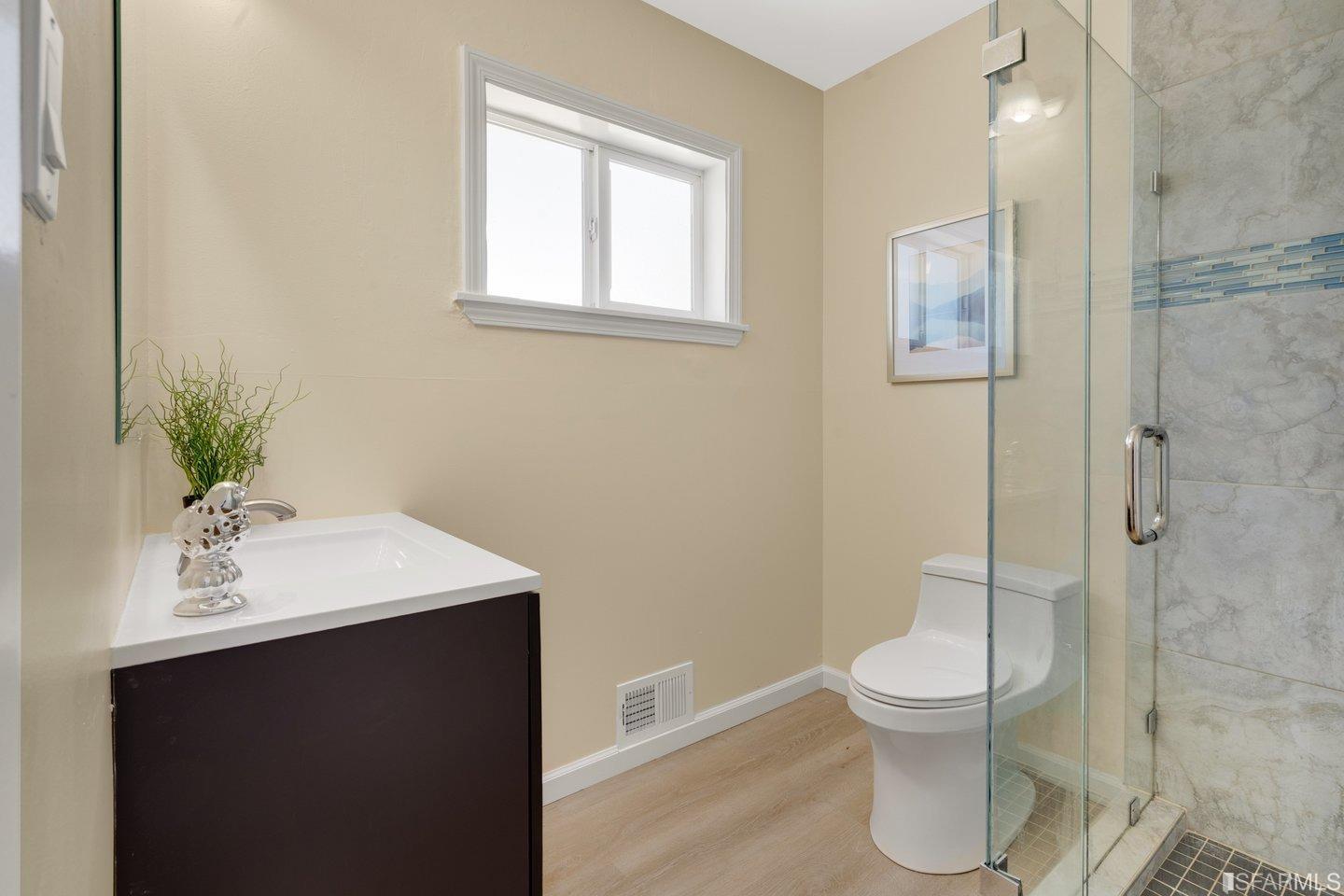 484 Lomond Drive Pacifica, CA 94044 - Photo 18 of 25 a bathroom with a sink toilet and shower
