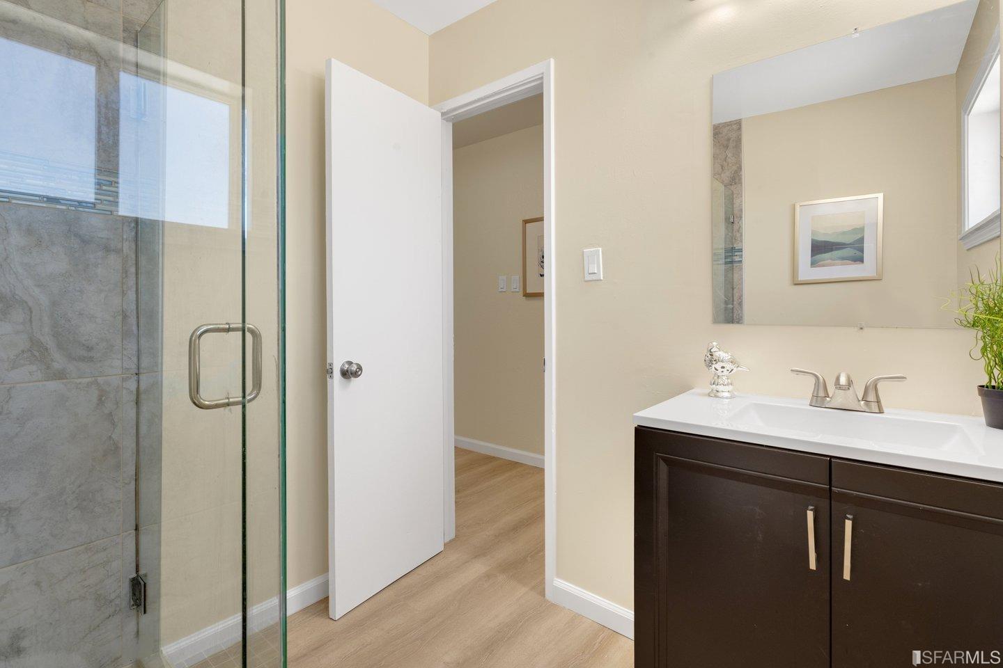 484 Lomond Drive Pacifica, CA 94044 - Photo 19 of 25 a bathroom with a sink and a mirror