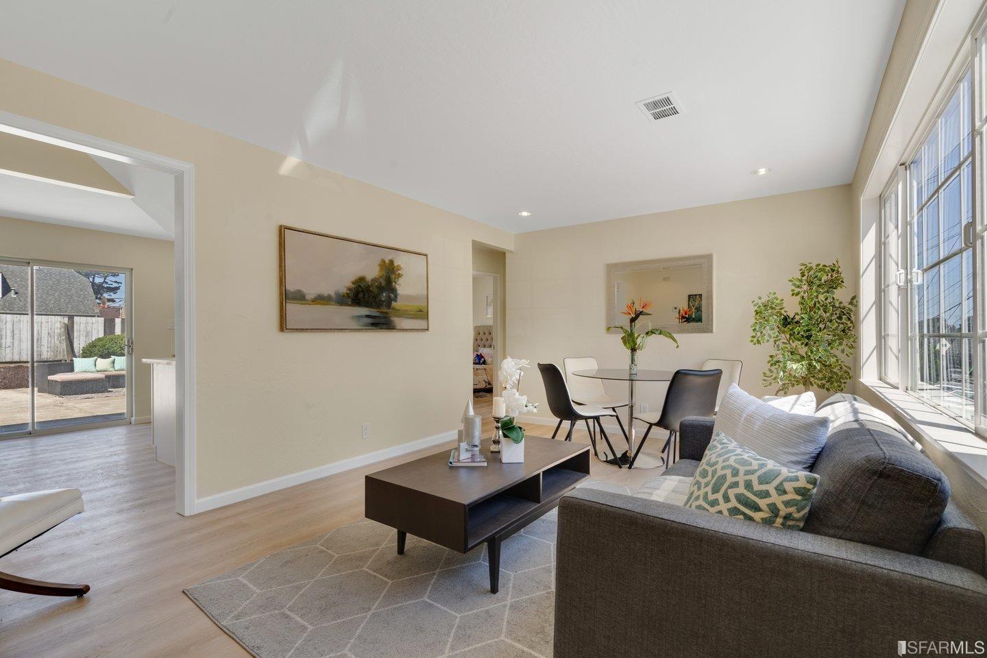 484 Lomond Drive Pacifica, CA 94044 - Photo 3 of 25 a living room with furniture and a table
