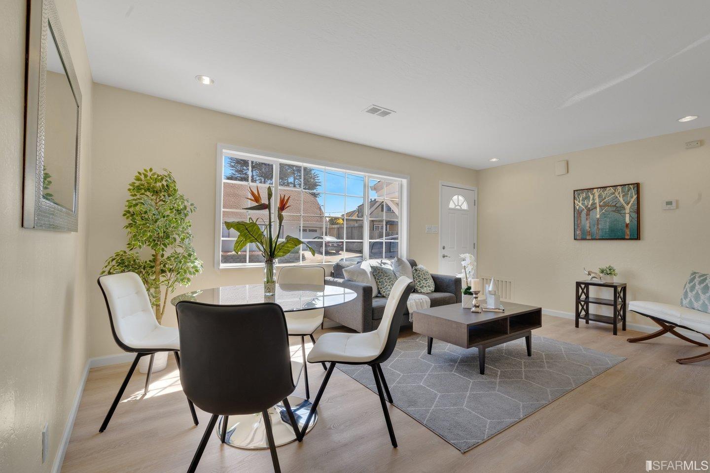 484 Lomond Drive Pacifica, CA 94044 - Photo 4 of 25 a dining room with furniture and wooden floor