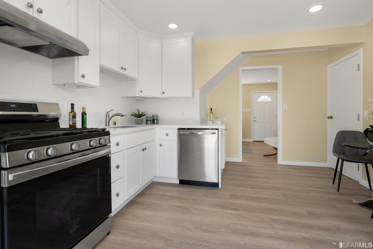 484 Lomond Drive Pacifica, CA 94044 - Photo 8 of 25 a kitchen with a sink a stove and cabinets