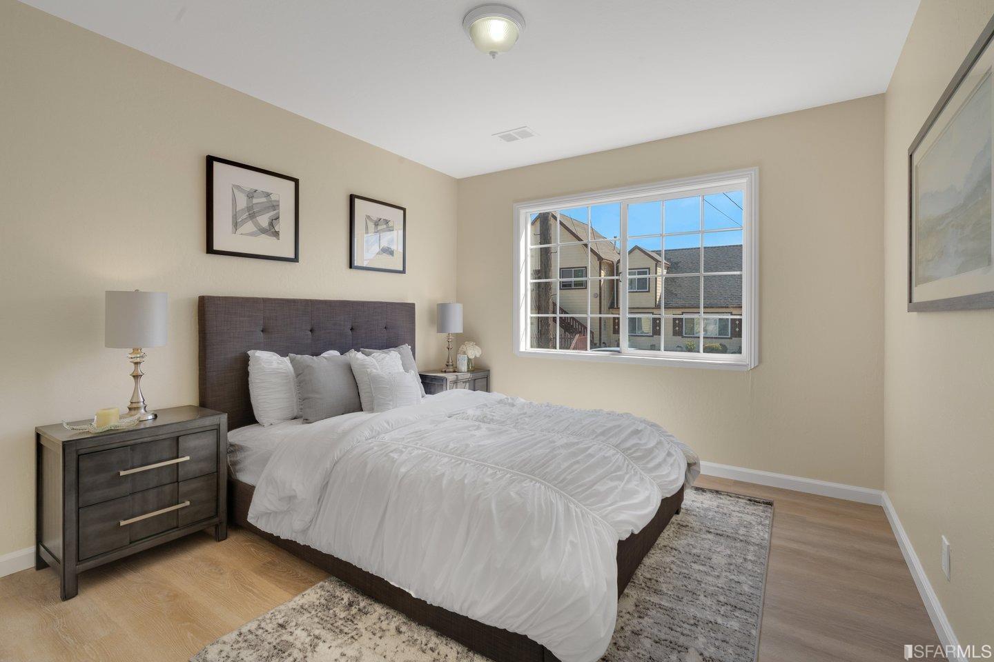 484 Lomond Drive Pacifica, CA 94044 - Photo 9 of 25 a bedroom with a bed and a window